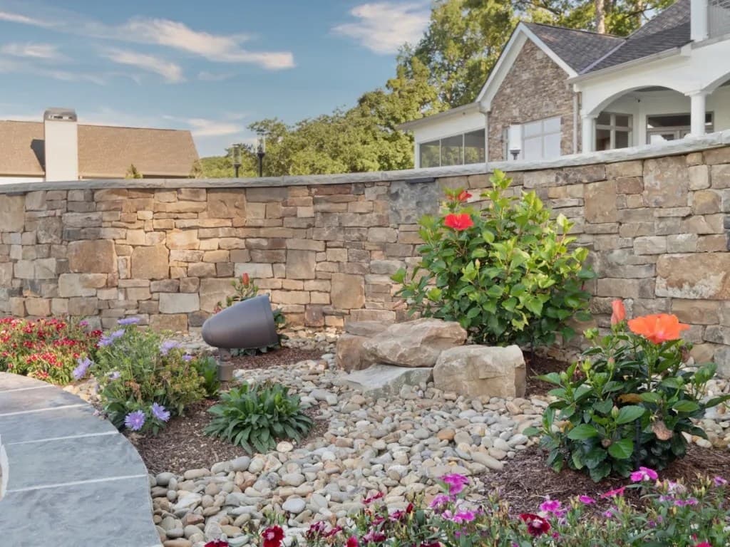 Outdoor speaker near stone wall