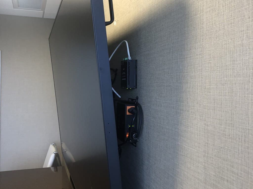 Equipment mounted behind TV